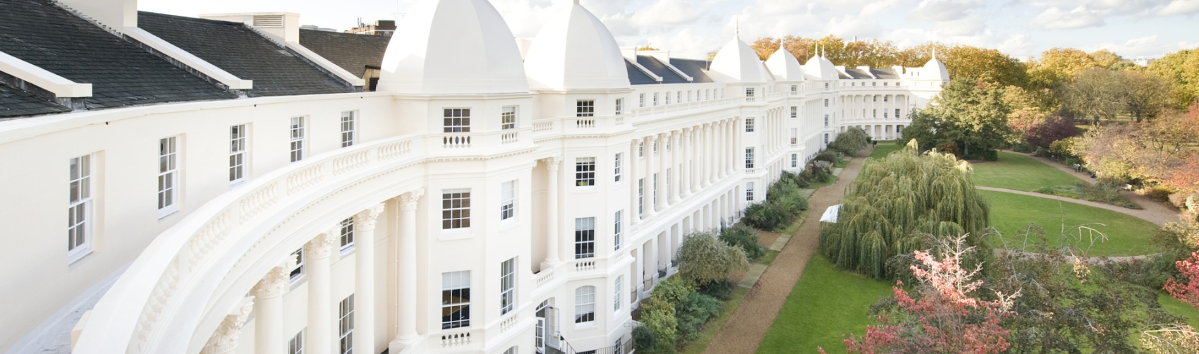 Sussex Place campus, white buildings to left of screen and green to the right.