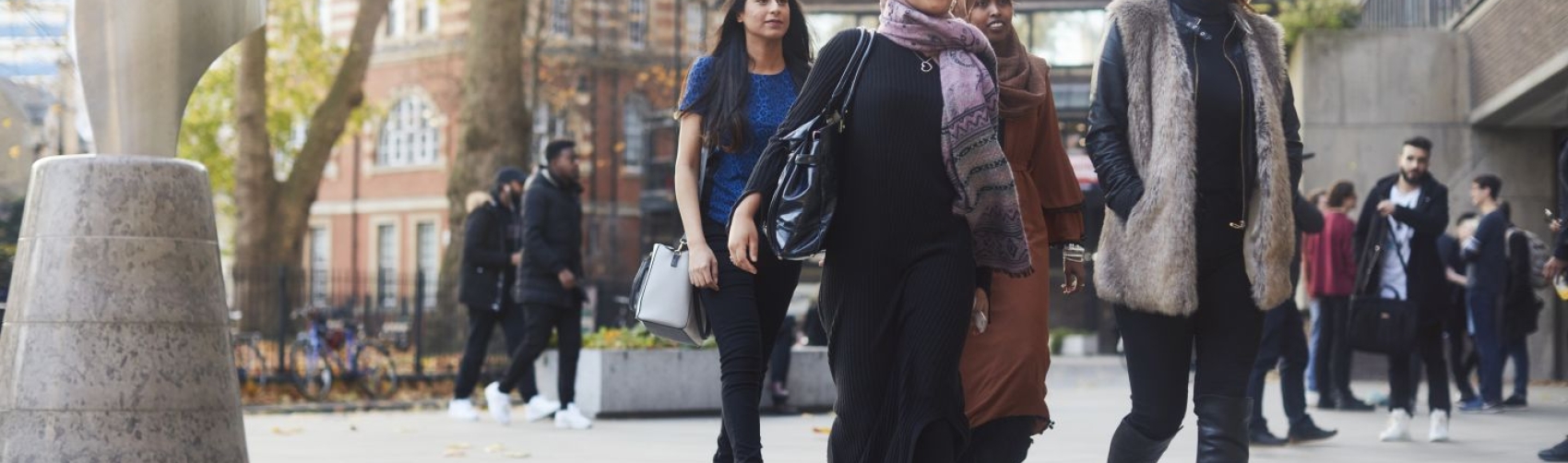 Students walking in front City University of London building.
